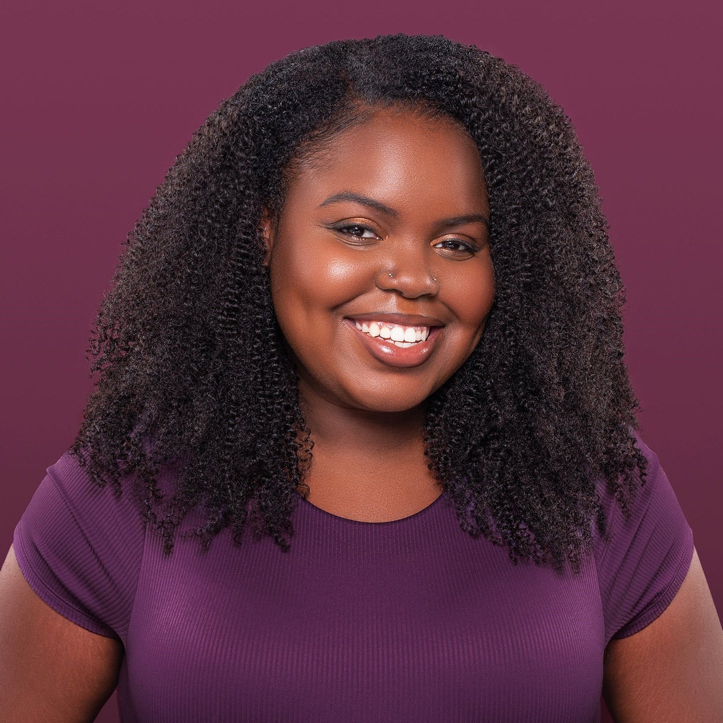 Silva U-Part Wig featuring a voluminous kinky-coily texture, designed to blend seamlessly with natural hair for bold styling.