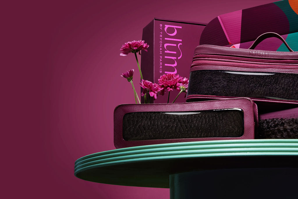 blum Beauty Clutch filled with hair extensions, showcasing its stylish design and spacious interior for beauty essentials.