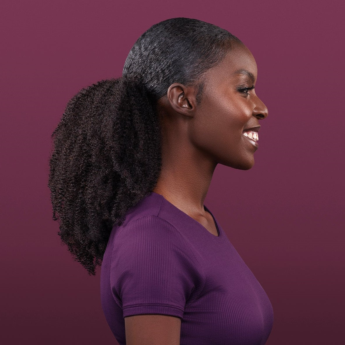 Onye Drawstring Ponytail featuring tight, springy coils, perfect for textured and voluminous hairstyles with a seamless finish.